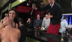 Busty dark brown fucked in front of a bar full of people!!!!